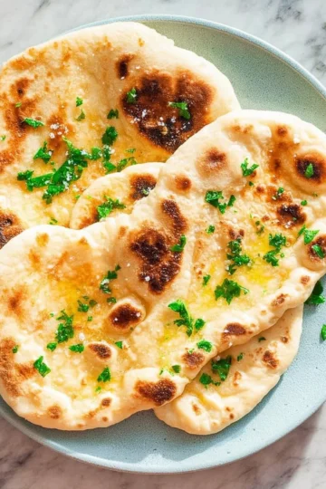 Delicious 2 ingredient naan bread made without yeast, freshly cooked and served.