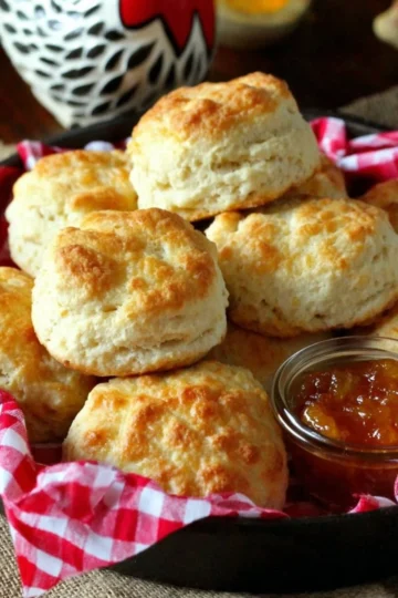 Fluffy Southern buttermilk biscuits on a wooden serving board