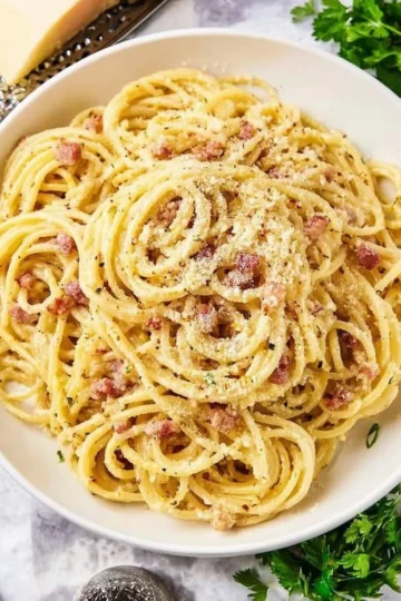 Plate of authentic Carbonara Pasta with fresh ingredients