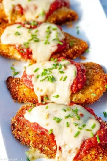 Delicious homemade chicken parmesan with marinara sauce and melted cheese