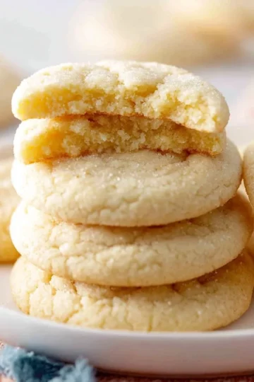 Delicious chewy sugar cookies on a plate, perfect for any occasion.