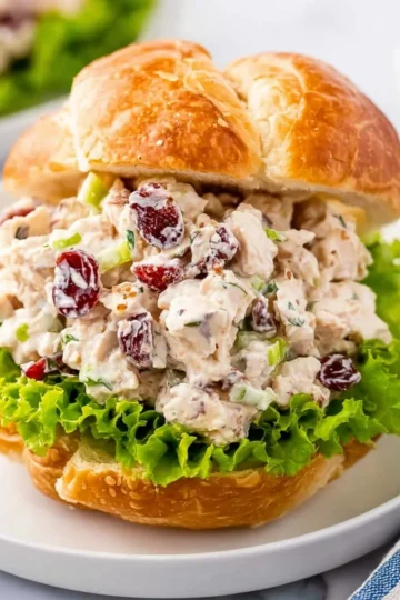 A delicious bowl of chicken salad with fresh vegetables and dressing