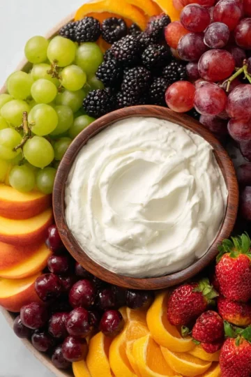 Cream cheese fruit dip served with fresh fruit, no marshmallow fluff included.
