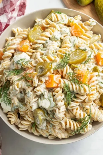 Delicious Dill Pickle Pasta Salad served in a bowl with fresh ingredients.
