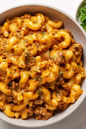 Homemade Hamburger Helper dish served in a bowl with fresh ingredients.
