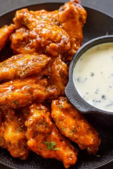 Crispy Air Fryer Buffalo Chicken Wings served with dipping sauce