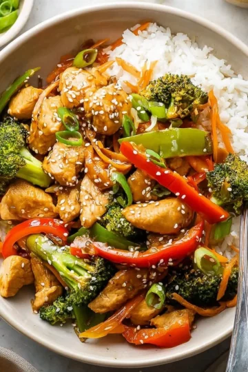 Colorful chicken stir fry with fresh vegetables in a pan