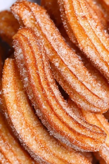 Delicious churros served with chocolate dipping sauce