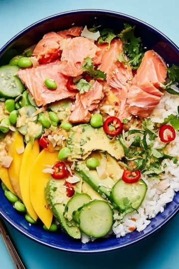 Coconut Rice Salmon Bowl featuring coconut-infused rice and grilled salmon.
