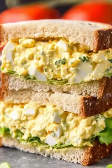 Delicious and easy egg salad in a bowl with herbs and spices
