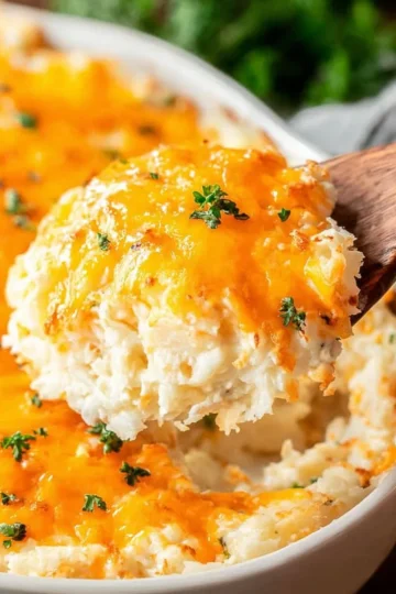 Delicious easy potato casserole topped with cheese and herbs