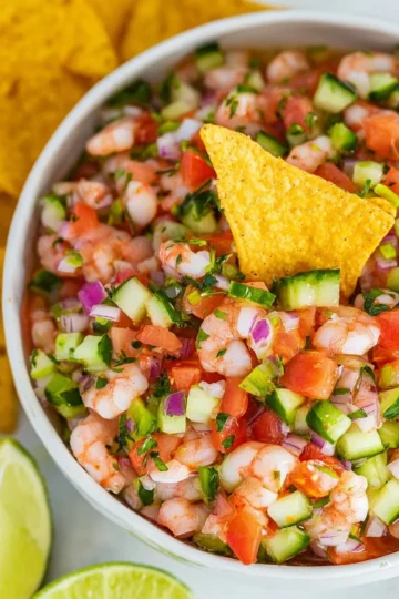 Bowl of easy shrimp ceviche garnished with lime and cilantro