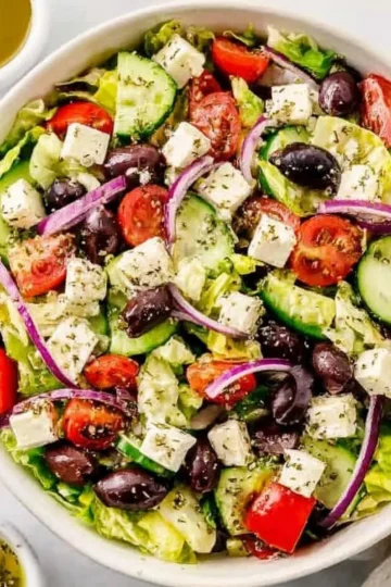 Colorful Greek Salad with tomatoes, cucumbers, olives, and feta cheese
