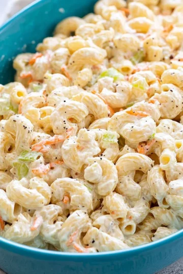 Bowl of creamy Hawaiian macaroni salad with vegetables and seasonings