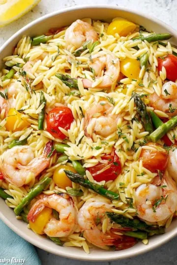 Delicious lemon orzo salad with fresh vegetables and zesty dressing