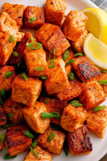 Delicious homemade salmon bites served on a plate with dipping sauce