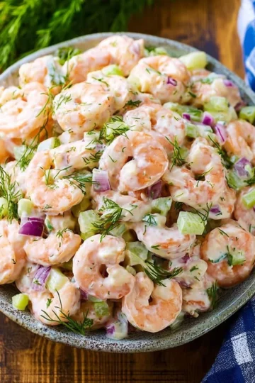 Fresh and vibrant shrimp salad with vegetables and dressing