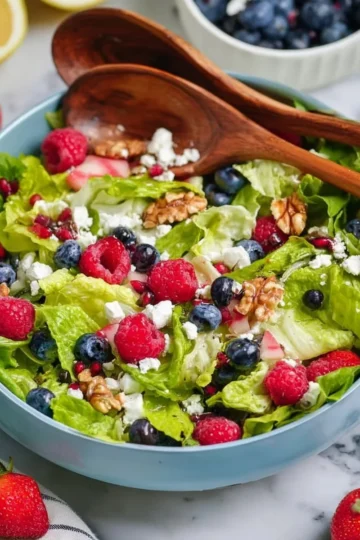 Colorful summer salad with fresh vegetables and herbs