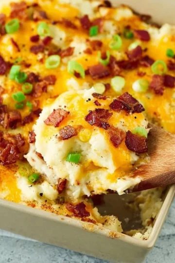 Delicious twice baked potato casserole served in a baking dish.