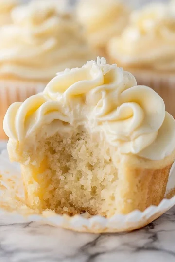 Delicious vanilla cupcakes topped with creamy frosting