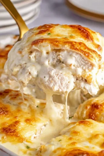 Delicious white chicken enchiladas topped with creamy sauce and cheese