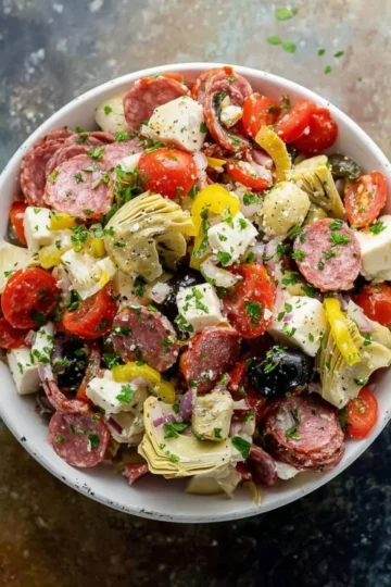Colorful Antipasto Salad with meats, cheeses, and fresh vegetables