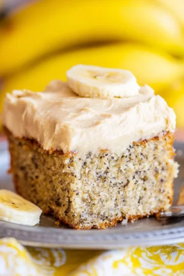 Delicious banana cake with brown butter icing on a white plate