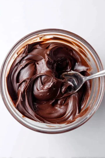 Delicious chocolate ganache spread over a decadent dessert.