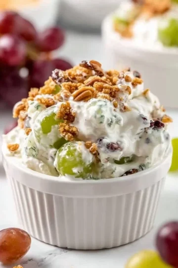 Delicious grape salad with fresh grapes, nuts, and creamy dressing