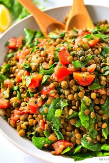 A vibrant Lentil Caper Salad featuring lentils, capers, and fresh vegetables.