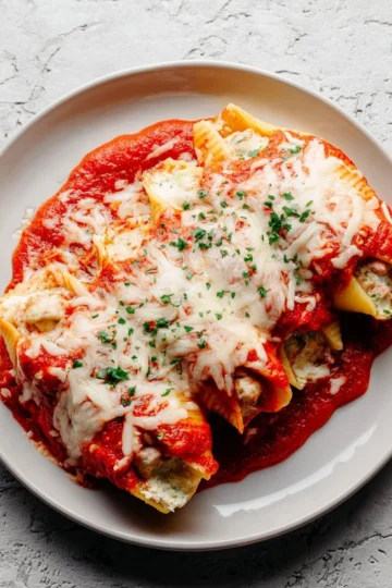 Delicious manicotti stuffed with cheese and sauce ready to serve
