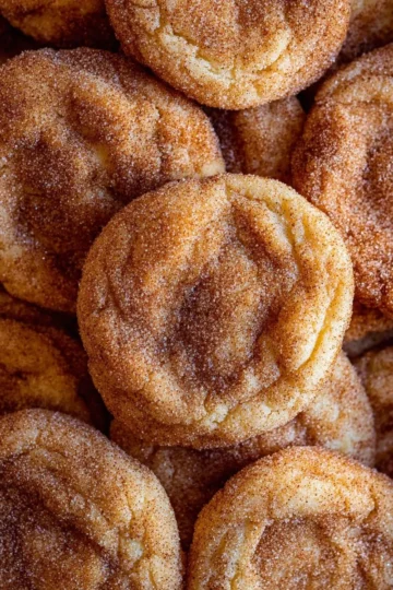 Deliciously soft and chewy snickerdoodle cookies on a baking tray