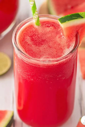 Freshly made watermelon juice in a glass with watermelon slices