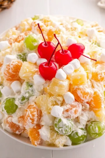 Delicious Ambrosia Salad with fruits and coconut in a serving bowl