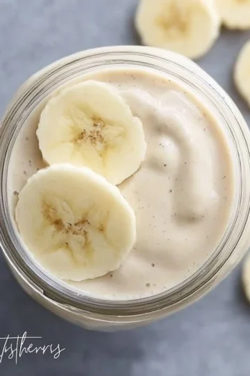 Delicious banana smoothie with fresh bananas and yogurt in a glass