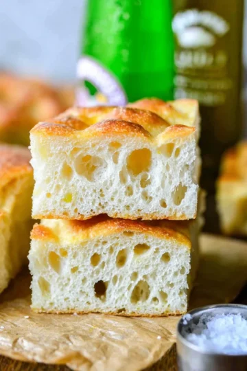 Freshly baked no-knead focaccia bread with herbs and olive oil